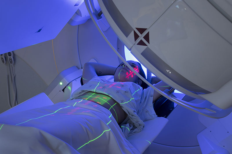 Woman Receiving Radiation Therapy, Radiotherapy Treatments for Cancer